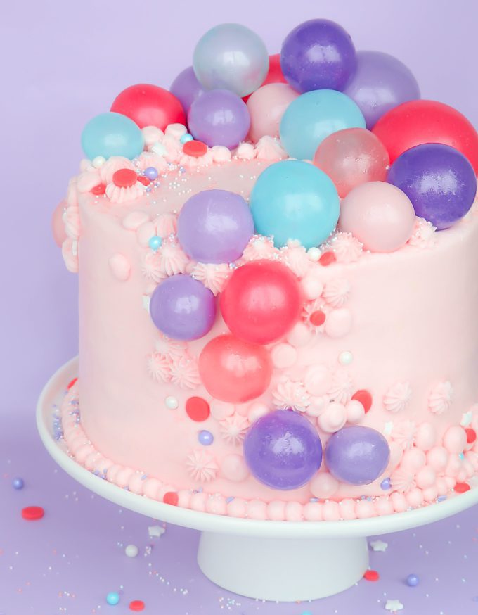 a pink cake with gelatin bubbles