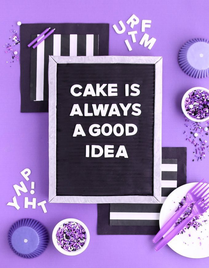 letter board cake on purple backdrop