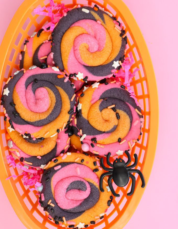 pink swirl Halloween cookies in an orange basket