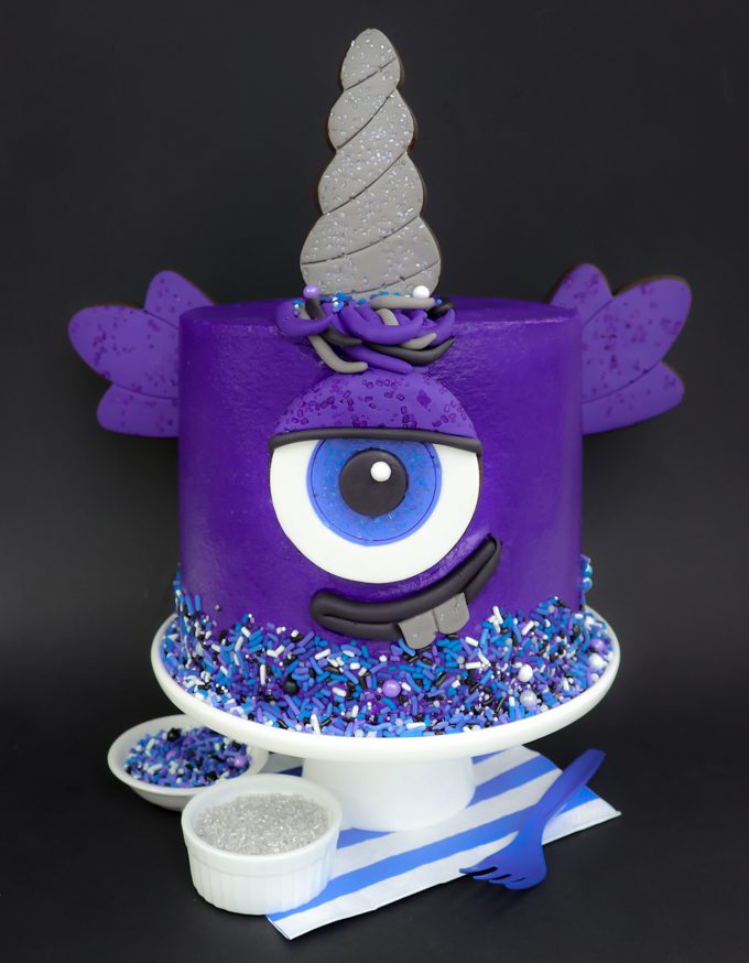 purple people easter cake on black background