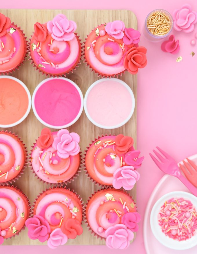 pink swirl cupcakes on pink background
