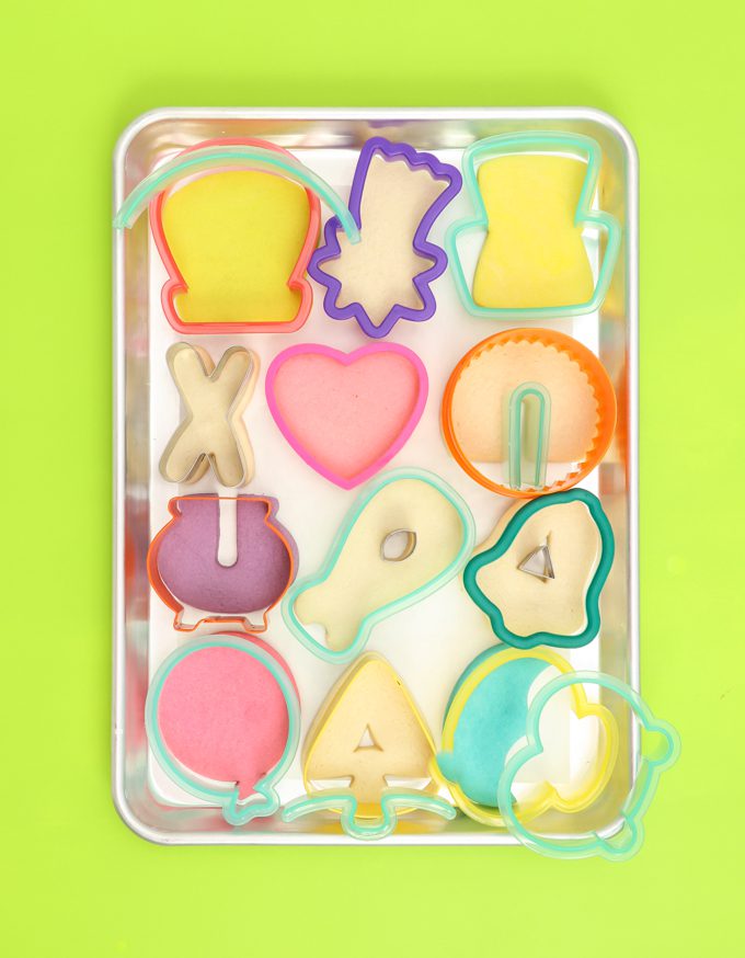 luck charms cookies with cutters on cookie sheet