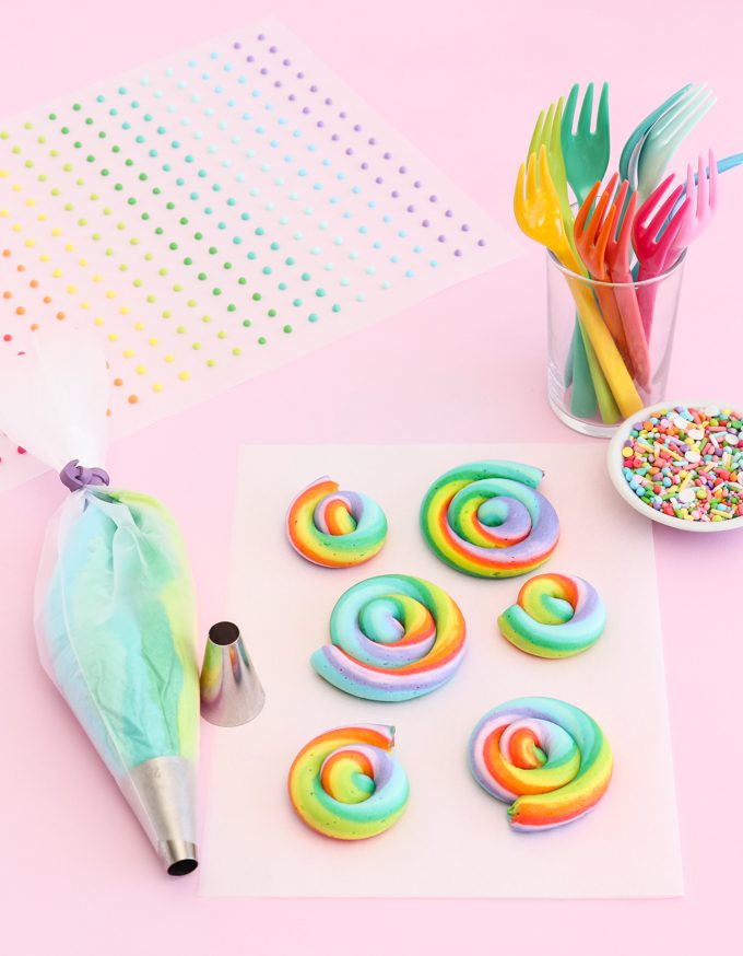 Swirls of rainbow frosting and piping bag.