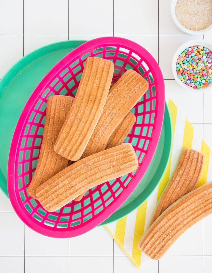Churro cookies in a pink basket.