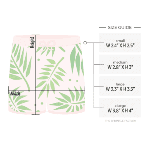 Clipart of a light pink swim trunk with green palm leaves on them with size guide.