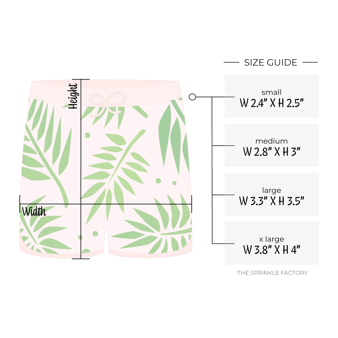 Clipart of a light pink swim trunk with green palm leaves on them with size guide.