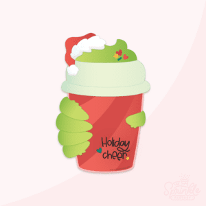 Clipart of a red mug with red strips and holiday cheer in black lettering held by green grinch hands filled with green hot cocoa and topped with a red santa hat with white trim and sprinkles.