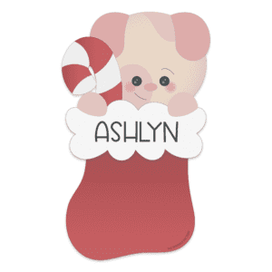 Red stocking with white trim with pink dog head holding a candy cane sticking out the top with the name Ashlyn on the white trim in black lettering.