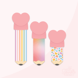 Clipart of 3 pencils with heart shaped erasers. The far left is the tallest with rainbow stripes, the middle one is shorter and has a rainbow ombre and the pencil on the right is the shortest with a rainbow heart print. Each pencil has a brown wood bottom with black lead.