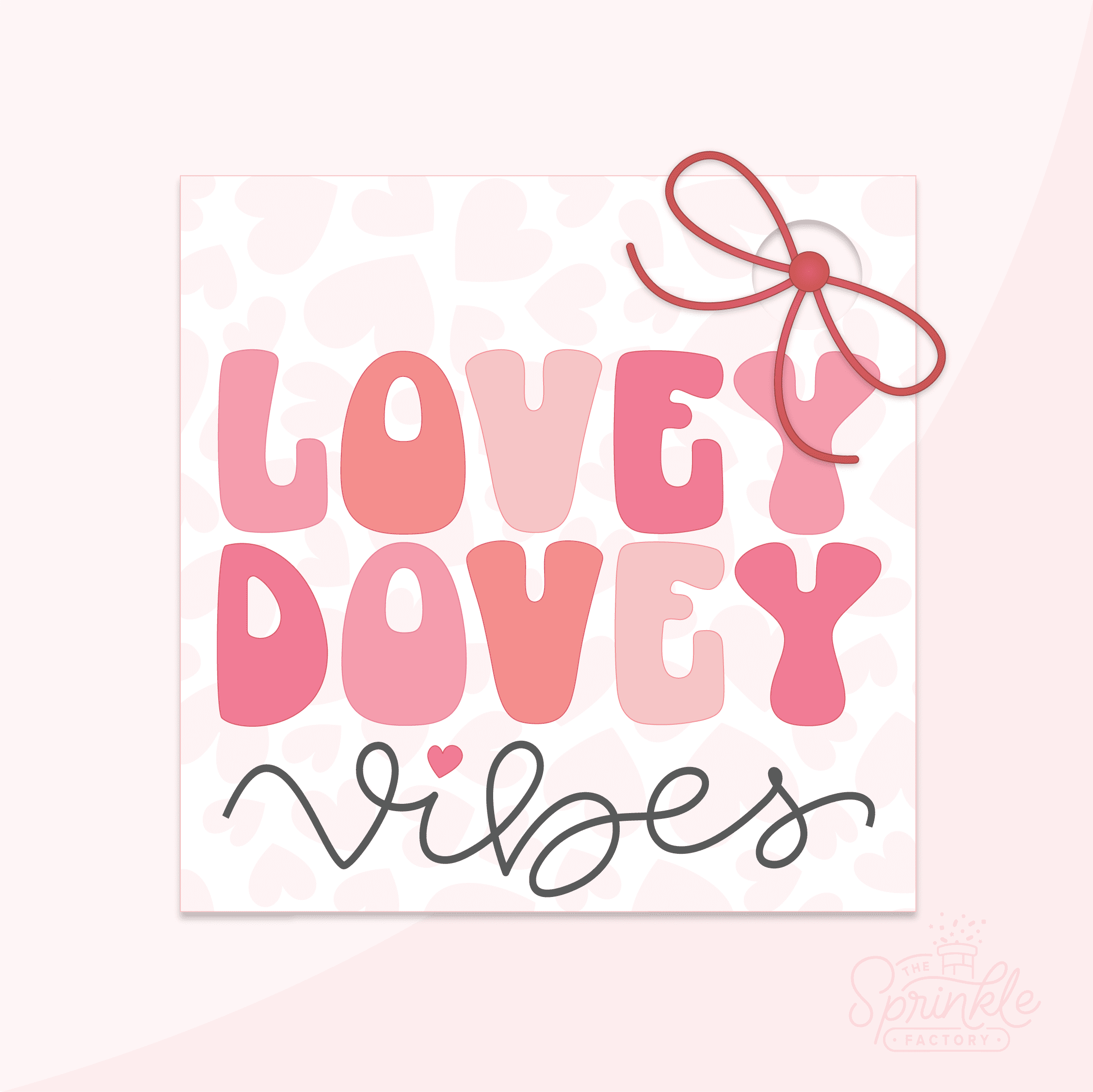 Clipart of a square white tag with a pink heart print on it with a hole for a red bow with LOVEY DOVEY written on it in alternating pink shades and vibes written below in black cursive lettering.