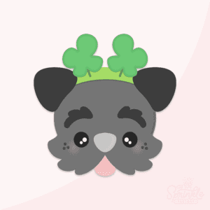 Clipart of a grey puppy face with black ears, dark grey eyebrows, a grey nose and pink tongue sticking out wearing a shamrock headband.