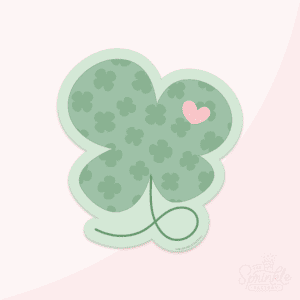 Green shamrock with tail and darker shamrock print with small pink heart over an offset pale green background.