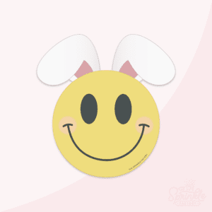Clipart of a yellow smiley face with black details with white bunny ears sticking out the top.
