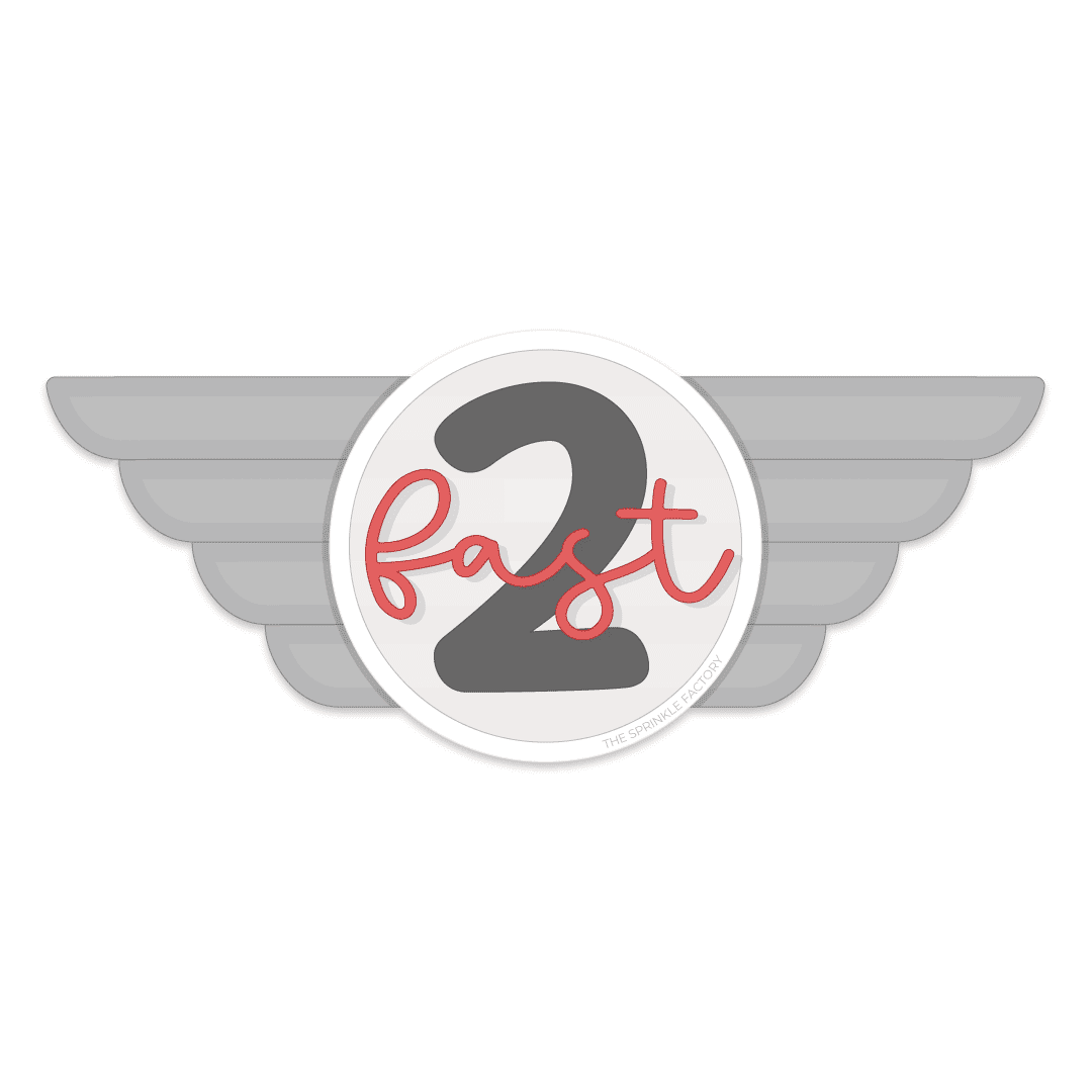 Grey wing race emblem with a white circle in the middle with a black 2 and the word fast in red cursive letter overtop.
