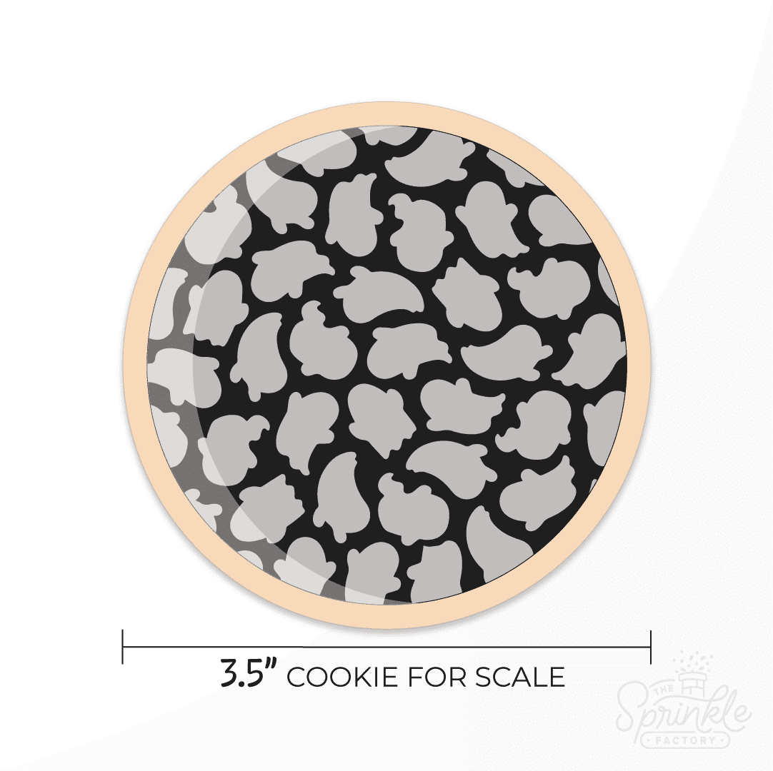 A digital image of a cookie with small grey ghost print on it with a black background and size guide below.