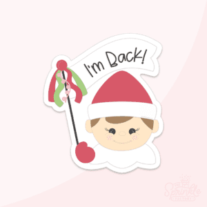 Clipart of a boy elf head with red hat and white collar holding a white flag with red and green accents and the words I'm Back on the flag in black.
