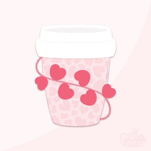 Pink take out coffee cup with white lid and red hearts wrapped around it with a pale pink heart print on the cup.