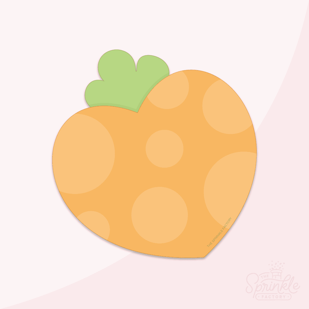 Clipart of an heart shaper carrot with pail orange polkadots and a green top.